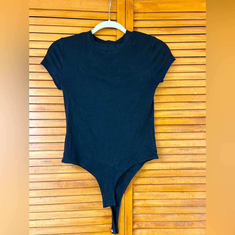 a new day. Black Crew Neck Bodysuit